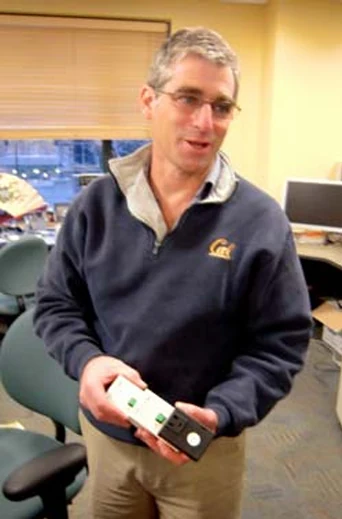 Dr. David Culler holding a wireless power meter